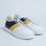 White sneakers with yellow and blue stripes