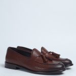 Brown penny loafers with tassels and dark tip